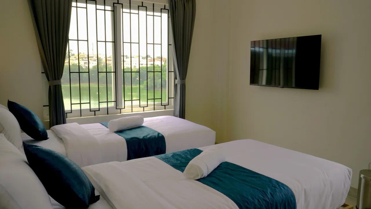 Premium Twin Lake View Room at Jiana Suites overlooking Arekere Lake, JP Nagar Bangalore